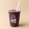 Purple smoothie in a Halo Bagels Cafe cup with a straw on a beige background