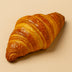 Croissant on a beige background butter halo bagels harlem