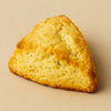 Triangular scone on a beige background harlem halo bagels