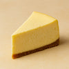Slice of cheesecake on a beige background halo bagels harlem