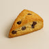 Chocolate chip scone on a beige background harlem chocolate chip. 