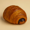 Croissant on a beige background chocolate halo bagels harlem