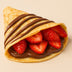 Crepe with chocolate and strawberries on a beige background harlem halo bagels