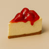 Slice of cheesecake with strawberry topping on a beige background halo bagels harlem